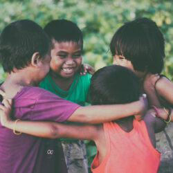 Children enjoying a group hug